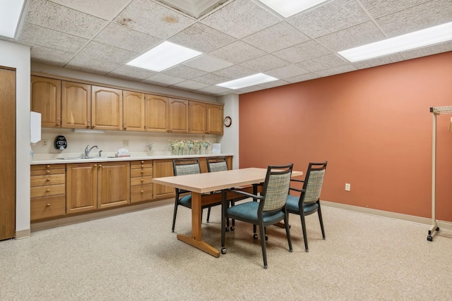 1425 28th St Unit 519, Minneapolis, MN 55408 - dining room with baseboards and a drop ceiling