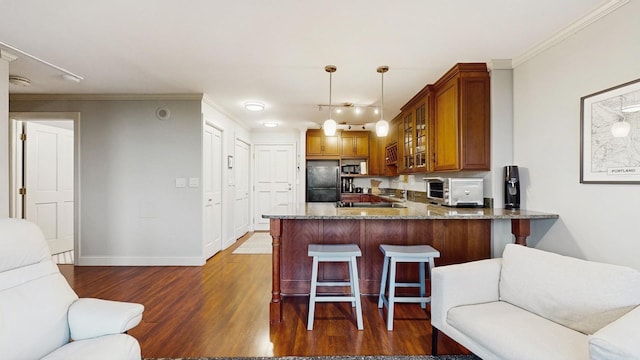 1425 28th St Unit 519, Minneapolis, MN 55408 - kitchen featuring freestanding refrigerator, dark wood-style flooring, a peninsula, glass insert cabinets, and brown cabinets