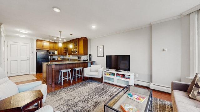 1425 28th St Unit 519, Minneapolis, MN 55408 - living area featuring wood finished floors, ornamental molding, baseboard heating, and recessed lighting