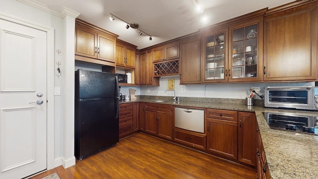1425 28th St Unit 519, Minneapolis, MN 55408 - kitchen with freestanding refrigerator, dishwasher, glass insert cabinets, dark stone countertops, and dark wood finished floors