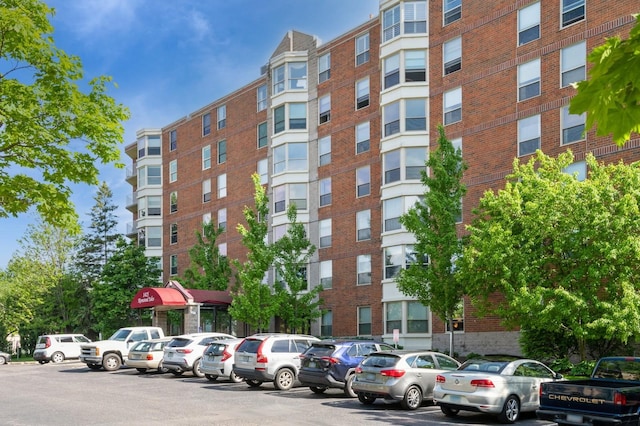 1425 28th St Unit 519, Minneapolis, MN 55408 - view of apartment building / complex featuring uncovered parking