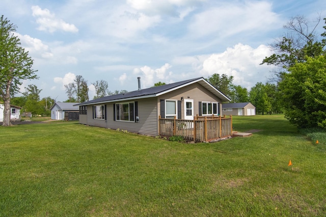 692 Round Lake Ln, Georgetown Twp, WI 54853 - rear view of house with a lawn and a wooden deck