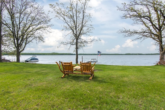 692 Round Lake Ln, Georgetown Twp, WI 54853 - view of grassy yard featuring a water view and a dock