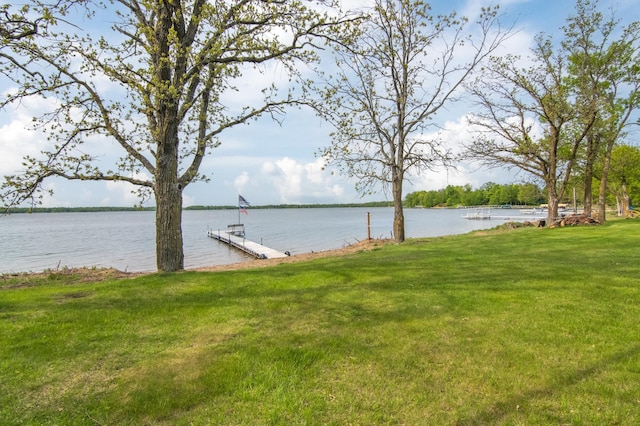 692 Round Lake Ln, Georgetown Twp, WI 54853 - view of green lawn featuring a water view and a boat dock