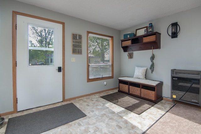 692 Round Lake Ln, Georgetown Twp, WI 54853 - doorway featuring heating unit and baseboards