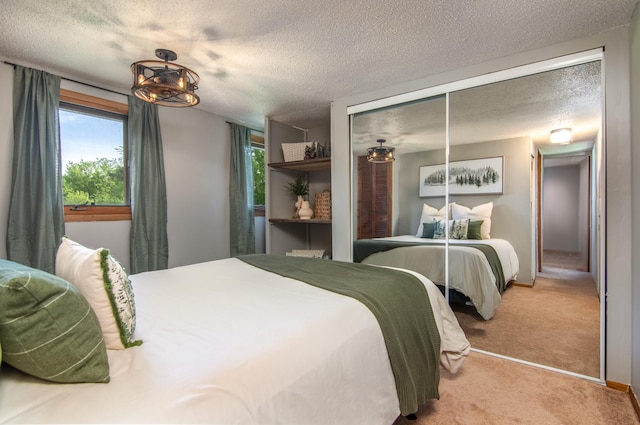 692 Round Lake Ln, Georgetown Twp, WI 54853 - bedroom with light colored carpet, multiple windows, a textured ceiling, and baseboards