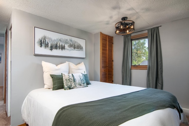 692 Round Lake Ln, Georgetown Twp, WI 54853 - bedroom with a textured ceiling and a closet