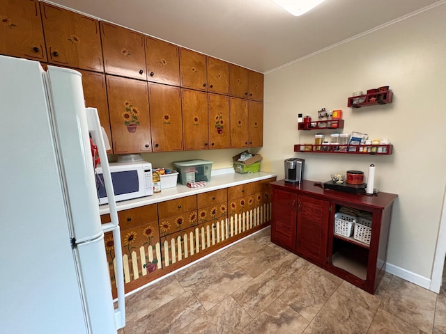 809 14th St S, Benson, MN 56215 - kitchen with white appliances, brown cabinetry, crown molding, and baseboards