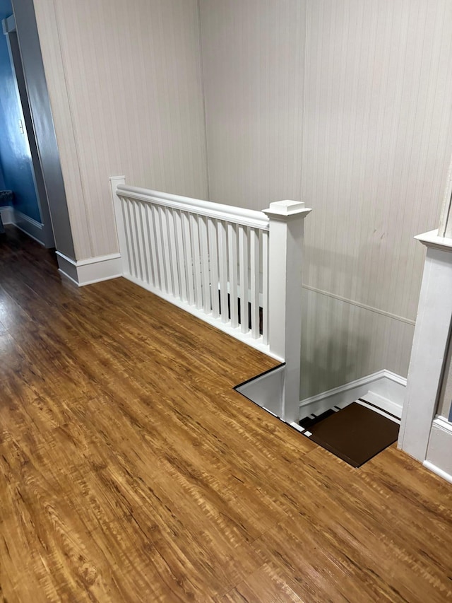 809 14th St S, Benson, MN 56215 - staircase featuring wood finished floors and baseboards
