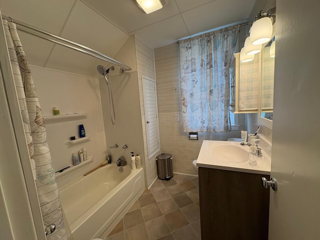 809 14th St S, Benson, MN 56215 - full bath featuring tile patterned flooring, shower / tub combo, vanity, tile walls, and toilet