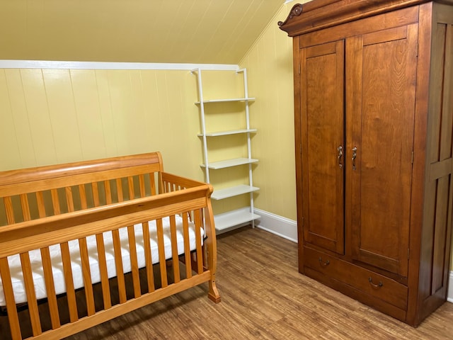 809 14th St S, Benson, MN 56215 - bedroom with wood finished floors, lofted ceiling, and baseboards