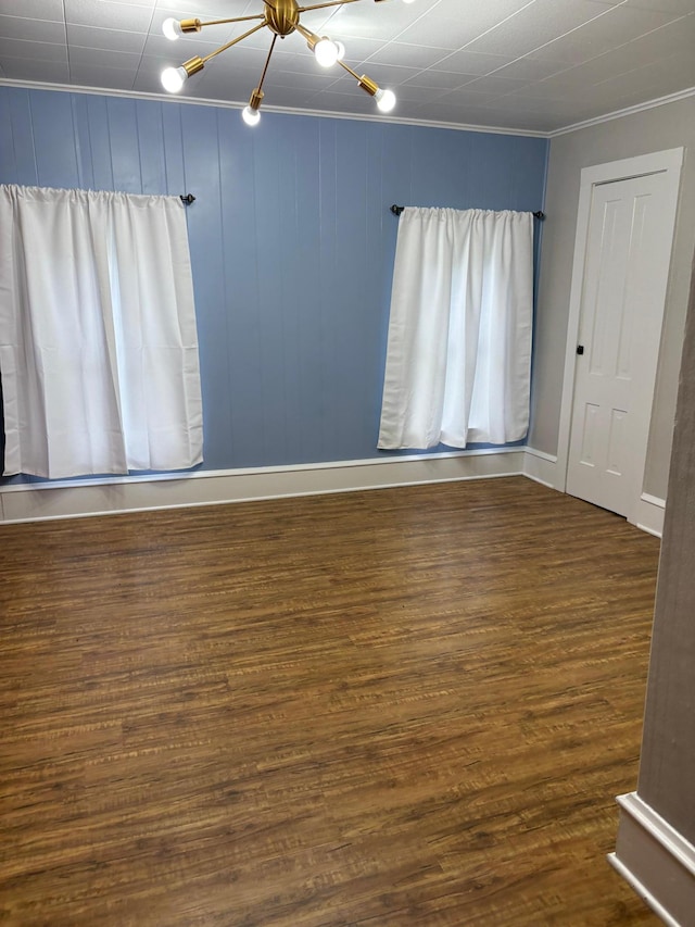 809 14th St S, Benson, MN 56215 - unfurnished room with a chandelier, wood finished floors, ornamental molding, and baseboards