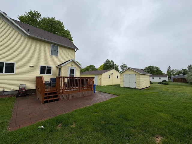 809 14th St S, Benson, MN 56215 - view of grassy yard featuring a patio and a wooden deck