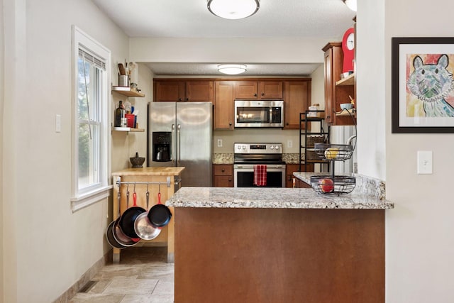 4034 Nokomis Ave, Minneapolis, MN 55406 - kitchen featuring stainless steel appliances, healthy amount of natural light, open shelves, and baseboards