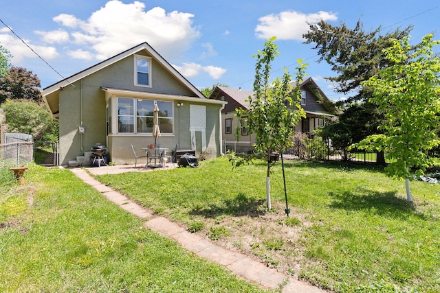 4034 Nokomis Ave, Minneapolis, MN 55406 - view of front facade with stucco siding, a patio area, and a gate