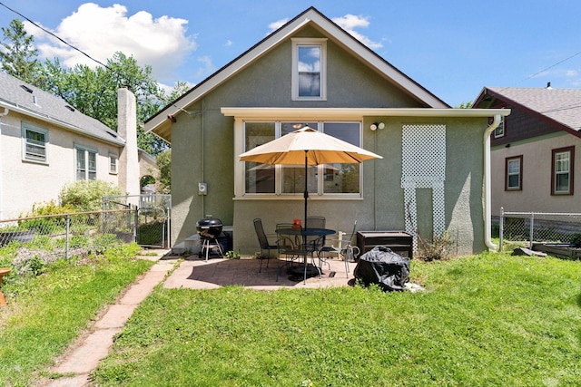 4034 Nokomis Ave, Minneapolis, MN 55406 - rear view of property with stucco siding, a patio, and a gate