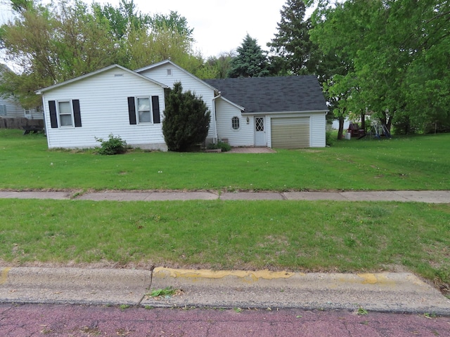 114 2nd St S, Truman, MN 56088 - single story home with an attached garage and a front lawn