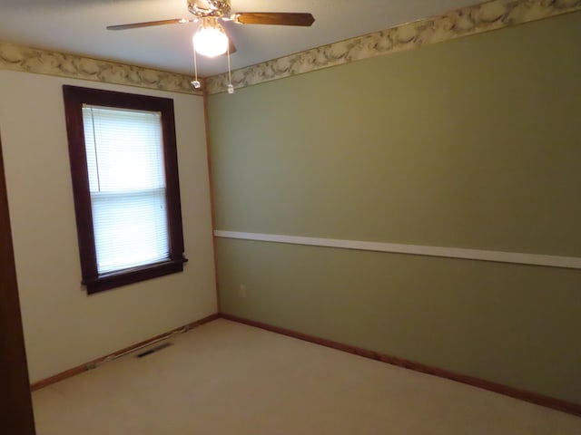 114 2nd St S, Truman, MN 56088 - unfurnished room with healthy amount of natural light, a ceiling fan, carpet, and baseboards
