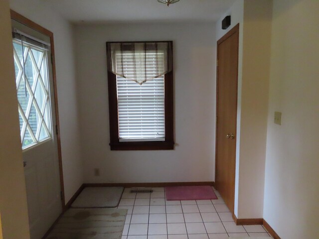 114 2nd St S, Truman, MN 56088 - unfurnished room featuring baseboards and light tile patterned floors