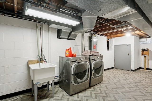 2197 Beam Ave, Maplewood, MN 55109 - washroom with electric panel, washer and dryer, and concrete block wall