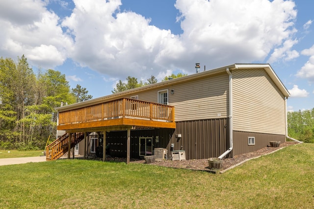 58885 County Road 136, Menahga, MN 56464 - rear view of house featuring a deck, stairs, and a lawn