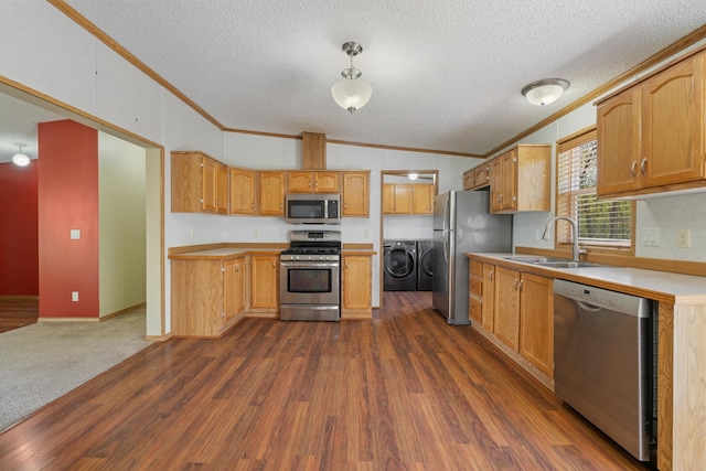 58885 County Road 136, Menahga, MN 56464 - kitchen with stainless steel appliances, crown molding, separate washer and dryer, a sink, and dark wood finished floors