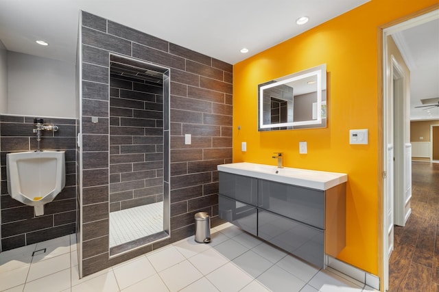 58885 County Road 136, Menahga, MN 56464 - bathroom featuring tile walls, walk in shower, recessed lighting, and vanity