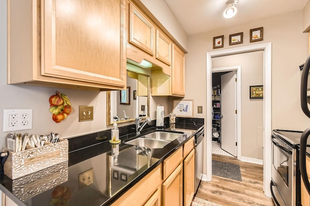 2727 43rd St Unit 102, Minneapolis, MN 55410 - kitchen featuring a sink, stainless steel appliances, light brown cabinetry, light wood-style flooring, and baseboards