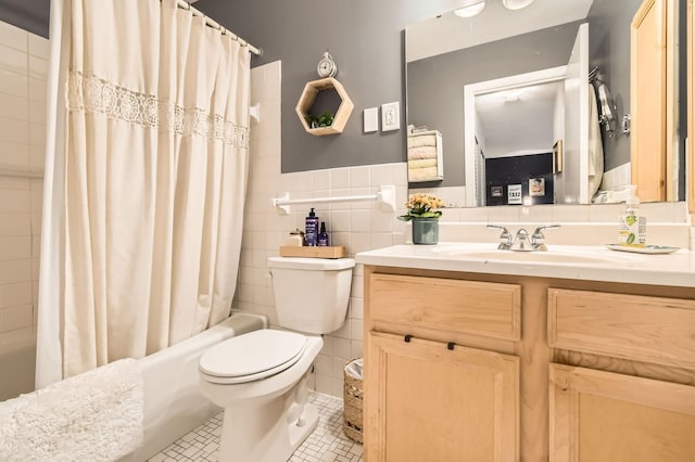 2727 43rd St Unit 102, Minneapolis, MN 55410 - bathroom with vanity, toilet, shower / bath combination with curtain, tile patterned flooring, and tile walls