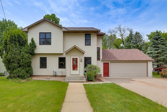 218 Owens St N, Stillwater, MN 55082 - view of front facade with a front yard, driveway, roof with shingles, and a garage