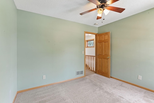 218 Owens St N, Stillwater, MN 55082 - carpeted spare room featuring baseboards, a ceiling fan, a textured ceiling, and a smoke detector