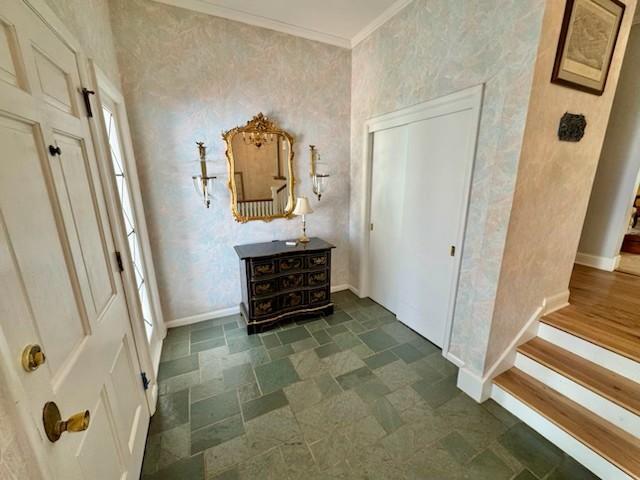 331 Willamor Cir, Albert Lea, MN 56007 - hallway with baseboards, crown molding, dark stone finish flooring, and wallpapered walls