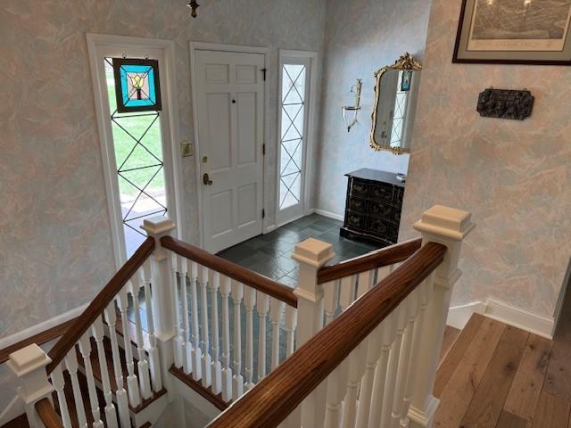 331 Willamor Cir, Albert Lea, MN 56007 - entrance foyer featuring wallpapered walls, baseboards, and wood finished floors