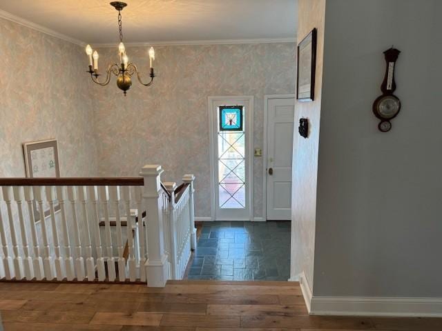 331 Willamor Cir, Albert Lea, MN 56007 - foyer with baseboards, a chandelier, wood finished floors, and ornamental molding