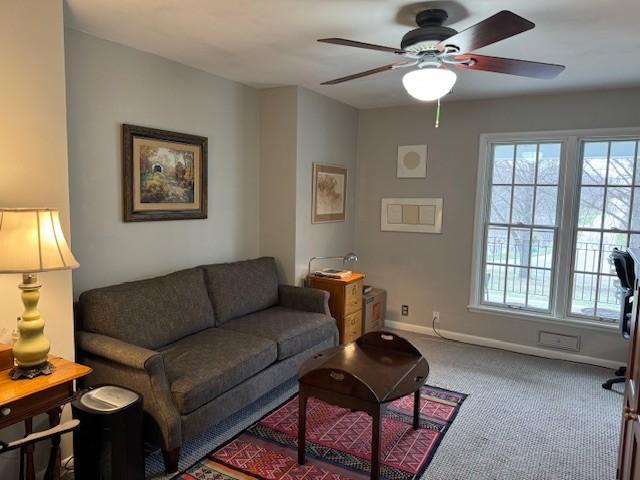 331 Willamor Cir, Albert Lea, MN 56007 - carpeted living area with ceiling fan and baseboards