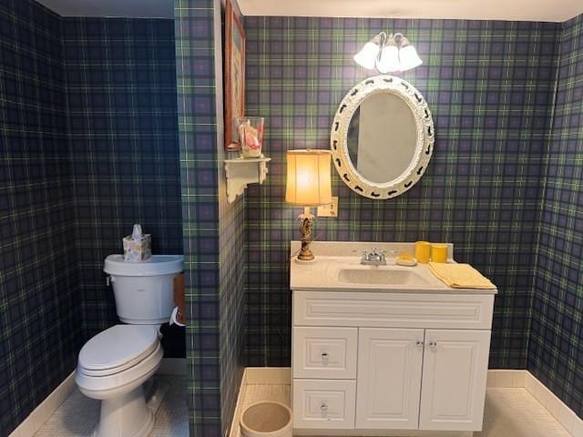 331 Willamor Cir, Albert Lea, MN 56007 - half bath with wallpapered walls, toilet, and vanity