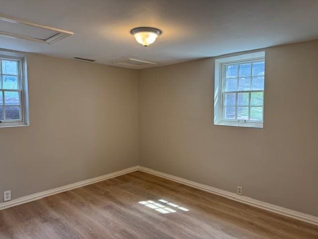 331 Willamor Cir, Albert Lea, MN 56007 - unfurnished room with wood finished floors, healthy amount of natural light, and baseboards
