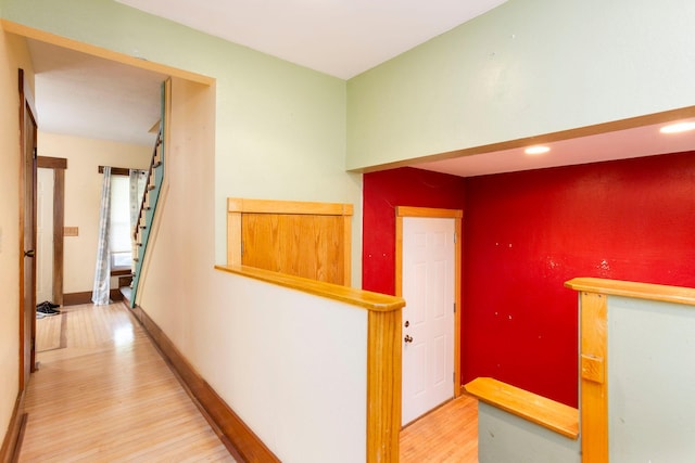 428 4th St, River Falls, WI 54022 - corridor with wood finished floors, stairway, baseboards, and recessed lighting