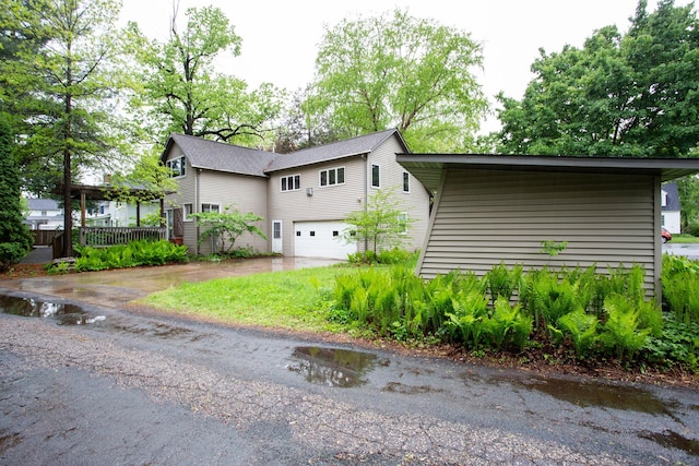 428 4th St, River Falls, WI 54022 - view of front of home with a garage and driveway