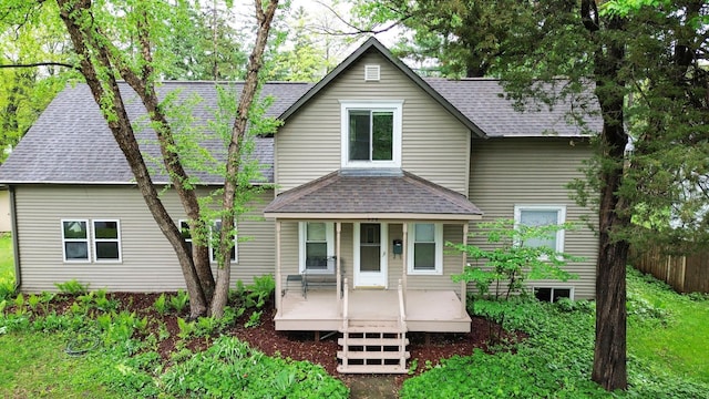 428 4th St, River Falls, WI 54022 - rear view of house with a shingled roof and covered porch