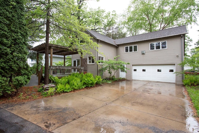 428 4th St, River Falls, WI 54022 - view of front of house featuring an attached garage, driveway, a deck, a pergola, and roof with shingles
