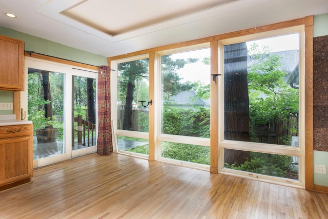 428 4th St, River Falls, WI 54022 - unfurnished sunroom with wood finished floors and healthy amount of natural light