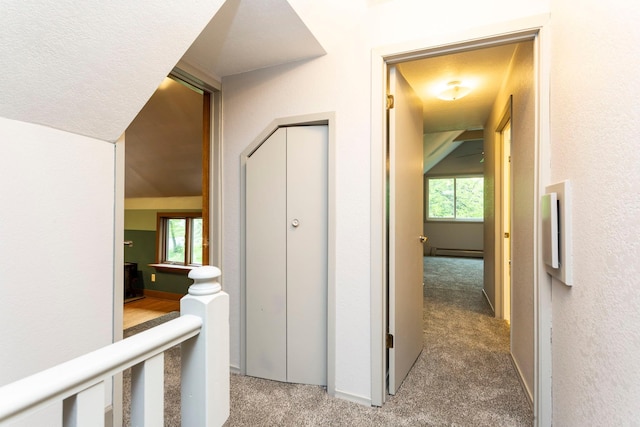 428 4th St, River Falls, WI 54022 - corridor with carpet flooring, healthy amount of natural light, baseboard heating, and baseboards