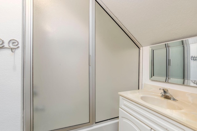 428 4th St, River Falls, WI 54022 - full bathroom featuring vanity and bath / shower combo with glass door