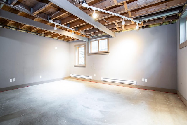 428 4th St, River Falls, WI 54022 - below grade area featuring a baseboard radiator and baseboards