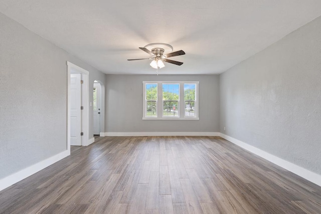 806 4th St, Marshall, MN 56258 - empty room with ceiling fan, wood finished floors, baseboards, and a textured wall