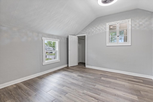806 4th St, Marshall, MN 56258 - additional living space with vaulted ceiling, wood finished floors, and baseboards