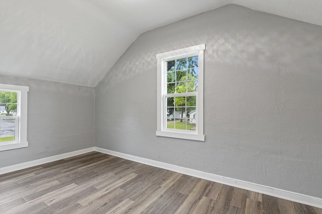 806 4th St, Marshall, MN 56258 - bonus room with lofted ceiling, wood finished floors, and baseboards