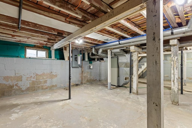 806 4th St, Marshall, MN 56258 - basement featuring stairway, heating unit, and electric panel