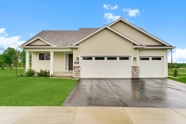 596 Emmy Ln, Hanover, MN 55341 - view of front of home with a garage, driveway, a front lawn, a shingled roof, and board and batten siding